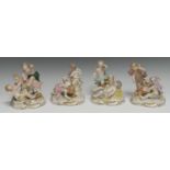 A set of four German figural groups, Allegorical of the Senses and Seasons, each with two