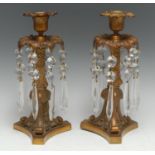A pair of 19th century gilt bronze mantel lustres, cast throughout with scrolling acanthus,