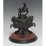 A sculptural 19th century Renaissance Revival dark patinated bronze inkwell, cast with Bacchic masks