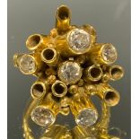 An unusual dress ring, designed by Herbert Korod, multi-layered cluster crest of fifteen