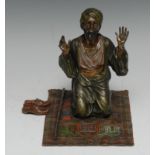 An Austrian cold painted Orientalist bronze, of an Arab, in the manner of Bergman, kneeling in