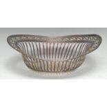 A George III Old Sheffield Plate boat shaped cake dish, wriggle-work engraved and pierced rim