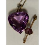 An amethyst and diamond heart pendant necklace, large pale pinky purple amethyst heart suspended