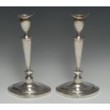 A pair of George V silver navette shaped table candlesticks, of George III Neo-Classical design,