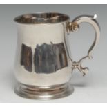 A George III silver bell shaped half pint mug, flared rim, capped double-scroll handle, skirted