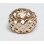 A gold coloured metal ring, domed lattice plateau, ring size Q, 6g