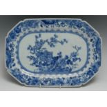 A Chinese canted rectangular meat plate, painted in tones of underglaze blue with the Three