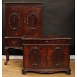 A matched suite of George II Revival mahogany cabinet furniture, comprising a cabinet on stand and a