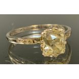 A Diamond solitaire ring, rectangular old cut diamond measuring approx 7.15mm x 6.42mm x 5.41mm,