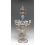 An Italian glass six-light candelabrum, decorated throughout in tones of pink, blue, green and