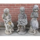 A set of three reconstituted stone garden statues, each as a playful child, the tallest, 111cm