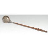 A William IV/early Victorian Scottish silver punch ladle, the bowl chased with stiff leaves, flowers