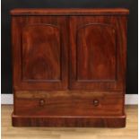 A Victorian mahogany low press cupboard, rounded rectangular top above a pair of panel doors