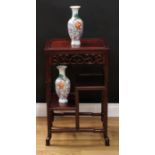 A Chinese hardwood floor standing jardiniere and vase stand, rectangular panel top above a pierced