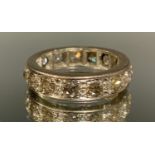A diamond full eternity ring, inset with sixteen round brilliant cut diamonds, each measuring approx