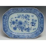 A Chinese canted rectangular meat plate, painted in tones of underglaze blue with chrysanthemums and