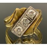 A diamond trilogy signet ring, twisted crest linear inset with three round brilliant cut diamonds,