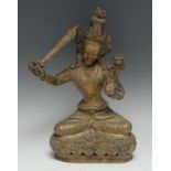 Chinese/Tibetan School, a bronze Tara, Manjushri, seated upon a lotus and holding sword, 33cm high