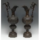 A pair of 19th century Renaissance Revival brown patinated and cold painted bronze Cellini ewers,