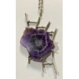 An unusual diamond and amethyst pendant necklace, irregular free form slice of rough polished