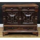 A 17th century oak mule chest, hinged rectangular top above a pair of blind frieze drawers, a two