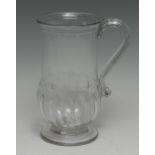 A George III gadrooned baluster glass lady's mug, reeded S-scroll handle, circular foot, snapped