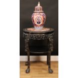 A large Chinese hardwood fish bowl or jardiniere stand, octofoil top with beaded border and inset
