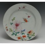 An 18th century Chinese famille rose plate, painted in polychrome enamels with a peony and other