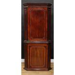 A 19th century walnut crossbanded mahogany floor standing corner cabinet, meandrous cornice above