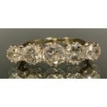 A diamond quintet line ring, central round old brilliant cut diamond approx 0.70ct, flanked either