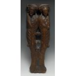 A 17th century sculptural oak fragment, carved with male and female herms terminating in scrolling