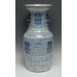 A Chinese baluster vase, painted in tones of underglaze blue with peonies, scrolling foliage and