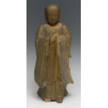 A Chinese giltwood figure, carved as a Buddhist monk, he stands, in long robes, 32cm high, 19th