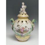 A Berlin Rococo Revival ogee-shaped potpourri vase and cover, painted with Watteauesque figures