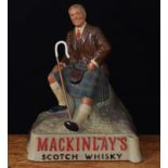 Advertising, Breweriana, Mackinlay's - a rubberoid 'back of bar' statuette, modelled as a seated