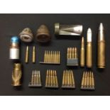 A collection of mixed assorted INERT FFE rounds, shell fuzes, etc. To include tail fin from a WW2