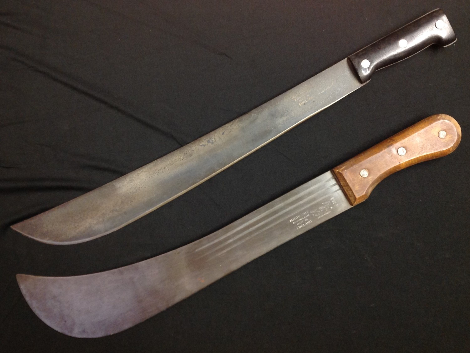 A pair of British Martindale Machetes: one with black composition grip with 460mm long blade,