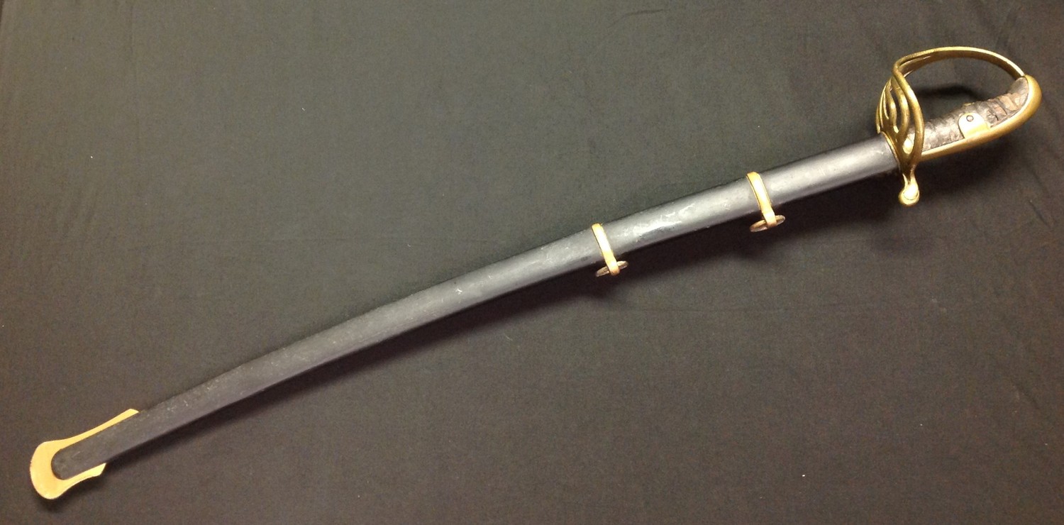 Enfield made Sword with single edged fullered blade 765mm in length. Spine of blade marked "
