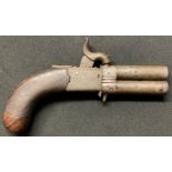 A small revolving double barrel Percussion cap pistol. Barrel length 67mm. Heavily rifled bore