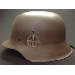 WW2 Third Reich M42 Stahlhelm Steel Helmet. Has been reused as a film prop or for re-enactment.