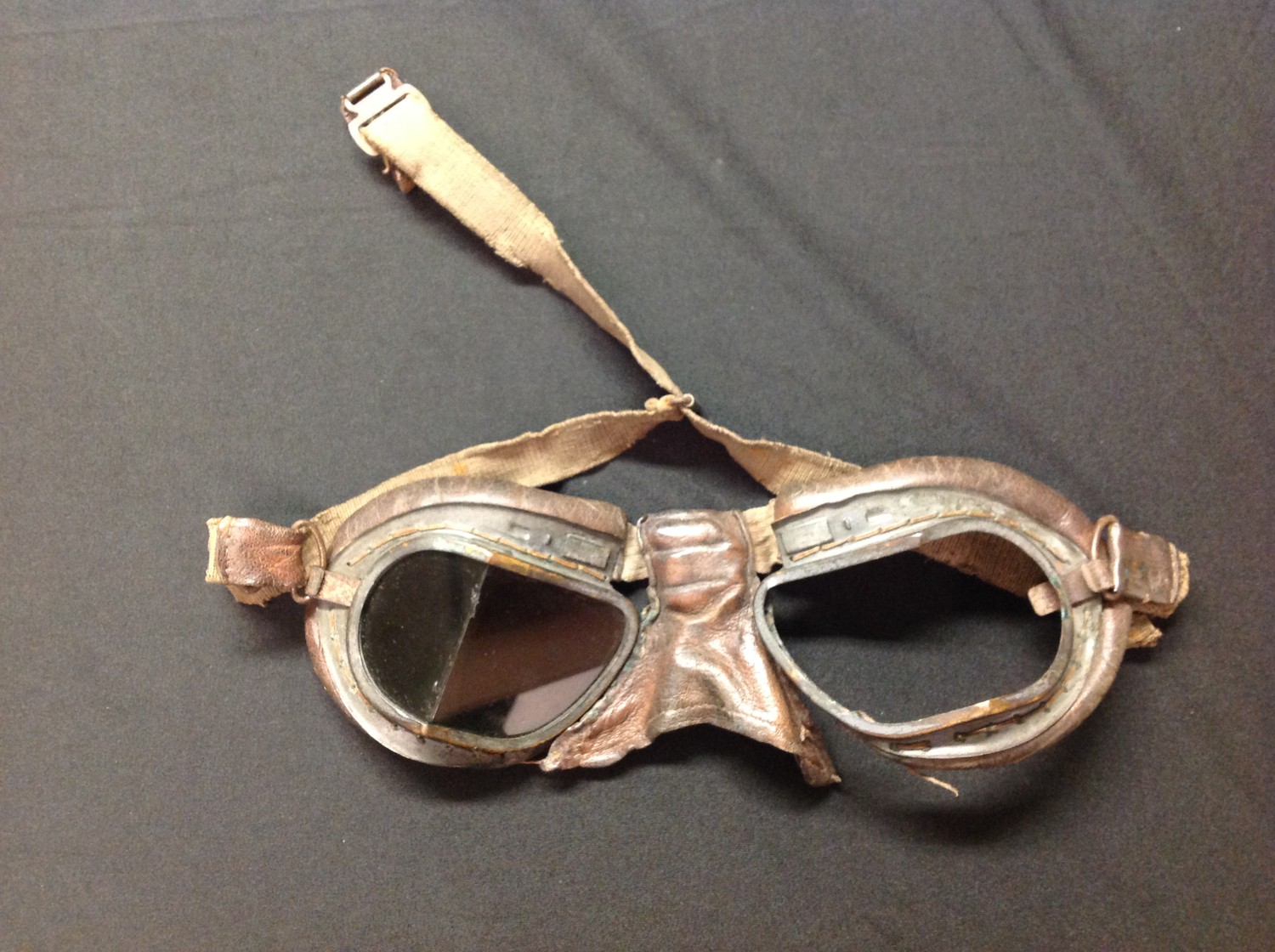 WW2 British RAF MKVIII Flying goggles. Missing one lens and adjustment bar to bridge of the nose.