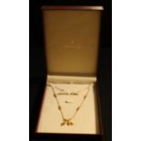 An 18ct gold fancy link droplet necklace, marked 750 on the clasp, 11.3g, boxed