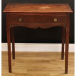 A George III oak side table, oversailing rectangular top above a long frieze drawer, brass drum