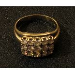 A 14ct gold, fifteen stone diamond ring, 6.9g