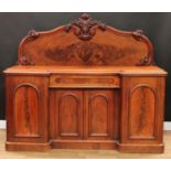 A Victorian mahogany inverted break-centre sideboard, substantial half gallery carved with scrolls