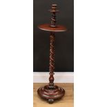 A Victorian walnut candle stand, turned urnular candlestick holder, shallow dished circular trays,