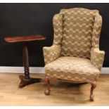 A George II Revival wingback armchair, stuffed-over upholstery, cabriole forelegs, 119cm high,