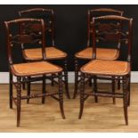 A set of four Regency brass mounted mahogany side chairs, each with a bobbin-flanked rope twist