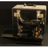 A Singer 222K portable electric sewing machine, black carry case