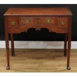 A George III mahogany crossbanded oak lowboy, rectangular top with moulded edge above three frieze